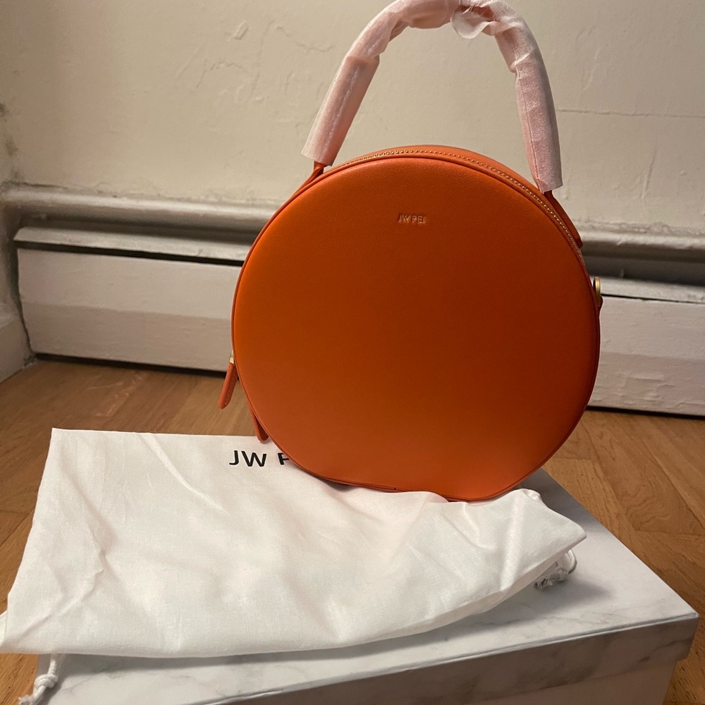 Beautiful orange jw.pei bag,brand new with box and duster bag,comes with a strap